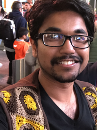 Rasel Ahmed wearing a vest and glasses